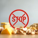 Top 5 mucus-causing foods to avoid: dairy, sugar, gluten, soy, and peanuts with caution symbols.